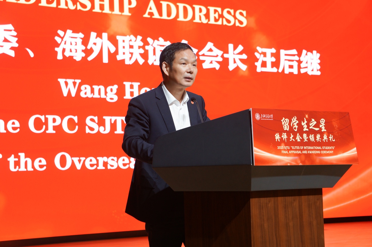 A person standing at a podium
Description automatically generated