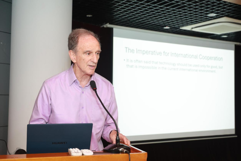 A person standing at a podium with a microphone

Description automatically generated