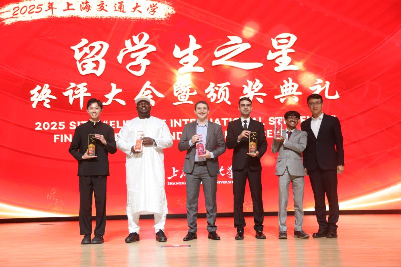 A group of men standing on a stage
Description automatically generated