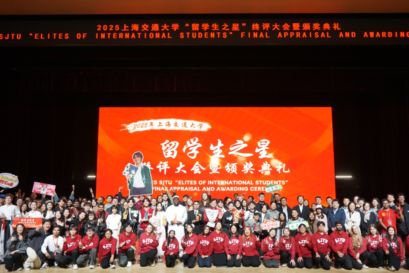 A group of people posing for a photo
Description automatically generated