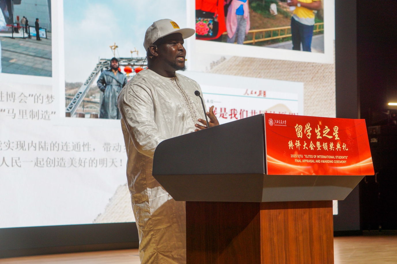 A person standing at a podium
Description automatically generated