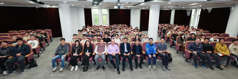 A group of people sitting in chairs

Description automatically generated